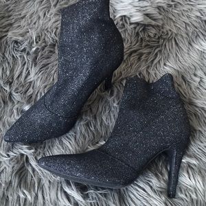 Black and glitter stiletto boots